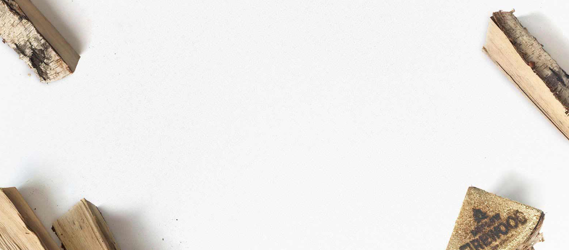 firewood logs in each of the four corners of the image with a speckled white/grey background