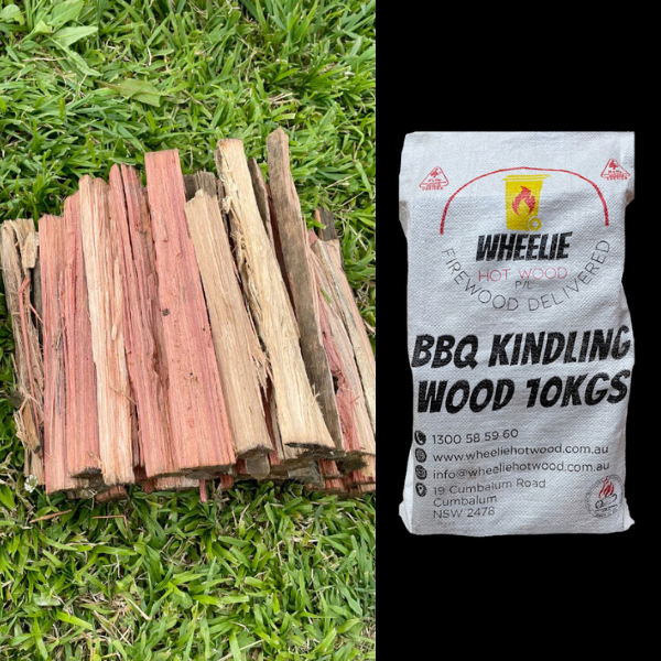 Stack of small BBQ kindling wood on grass next to a bag of Wheelie Hot Firewood Firewood BBQ Kindling Wood 10Kgs pictured on black background