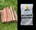 Stack of small BBQ kindling wood on grass next to a bag of Wheelie Hot Firewood Firewood BBQ Kindling Wood 10Kgs pictured on black background